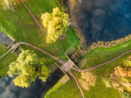 Beautiful Vilnius city top down view in autumn with orange and yellow foliage. Aerial evening view. Fall city scenery in Vilnius, Lithuaniaの写真素材