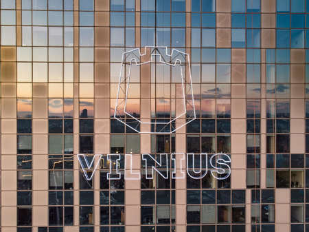 VILNIUS, LITHUANIA - OCTOBER 2020: Logo of Vinius city on government building. Beautiful aerial...