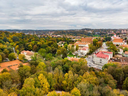 Beautiful Vilnius city panorama in autumn with orange and yellow foliage. Aerial evening view. Fall city scenery in Vilnius, Lithuaniaの写真素材