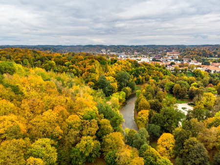 Beautiful Vilnius city panorama in autumn with orange and yellow foliage. Aerial evening view. Fall city scenery in Vilnius, Lithuaniaの写真素材