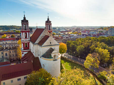 Beautiful Vilnius city panorama in autumn with orange and yellow foliage. Aerial evening view. Fall city scenery in Vilnius, Lithuaniaの写真素材