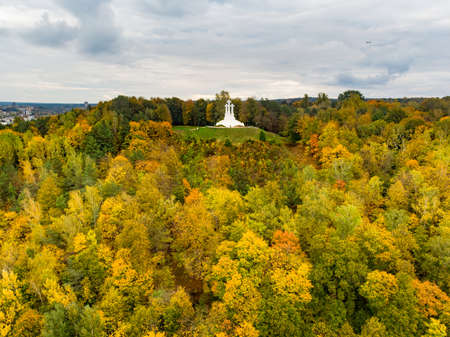 Aerial view of the Three Crosses monument overlooking Vilnius Old Town on sunset. Vilnius landscape from the Hill of Three Crosses, located in Kalnai Park, Lithuaniaの写真素材
