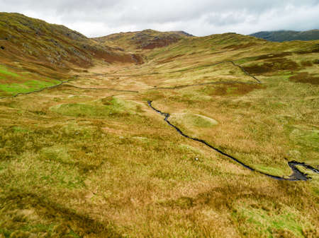Aerial sunset view of the Lake District, famous for its glacial ribbon lakes and rugged mountains. Popular vacation destination in Cumbria, North West England. Tourist attractions in Great Britain.の写真素材