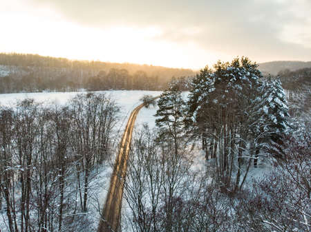 Beautiful aerial view of snow covered pine forests. Rime ice and hoar frost covering trees. Scenic winter landscape near Vilnius, Lithuania.の写真素材