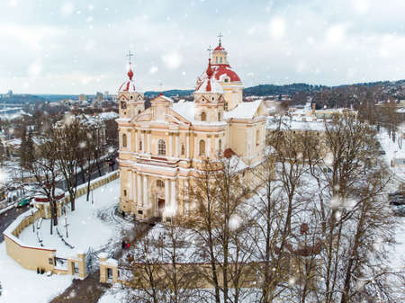 Aerial view of the Church of St. Peter and St. Paul, located in Antakalnis district in Vilnius. Beautiful winter day in the capital of Lithuania. Winter city scenery in Vilnius, Lithuania.の写真素材