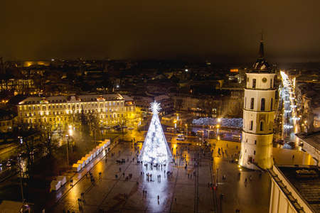 VILNIUS, LITHUANIA - NOVEMBER 27, 2021: Aerial view of decorated and illuminated Christmas tree on the Cathedral Square at night, Vilnius, Lithuaniaのeditorial素材
