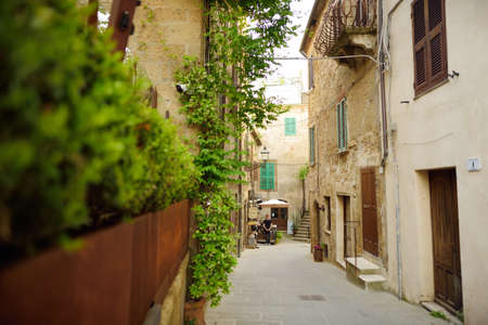 PITIGLIANO, ITALY - JUNE 8, 2019: Narrow old streets of the famous Pitigliano town, located atop a...