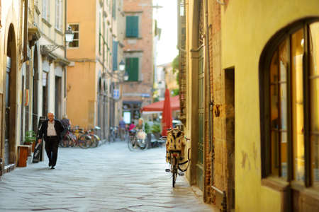 LUCCA, ITALY - JUNE4, 2019: Beautiful medieval streets of Lucca city, known for its intact Renaissance-era city walls and well preserved historic center. Province of Lucca, Tuscany, Italy.のeditorial素材