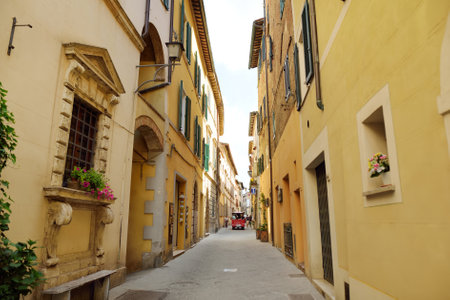 MONTEPULCIANO, ITALY - JUNE 6, 2019: Narrow old streets of Montepulciano town, located on top of a limestone ridge surrounded by vineyards. Vino Nobile wine territory. Tuscany, Italy.のeditorial素材