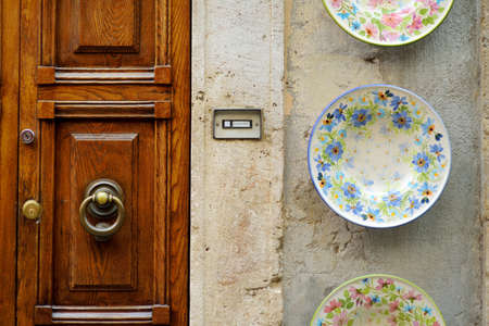 SORANO, ITALY - JUNE 8, 2019: Ceramic dishes handpainted in Sorano, an ancient medieval hill town...