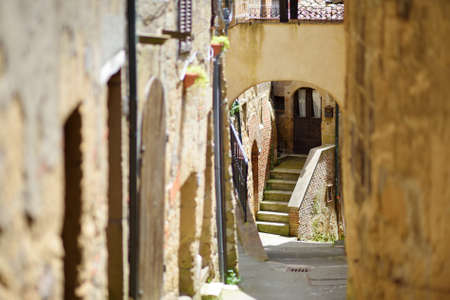 The narrow streets of Sorano, an ancient medieval hill town hanging from a tuff stone over the Lente...
