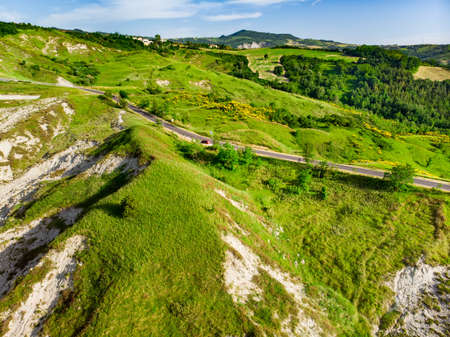 Picturesque aerial views of green fields and hills surronding San-Marino microstate. Travelling...