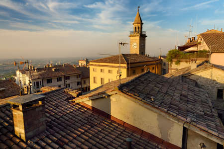 Beautiful sunset view of San Marino microstate and Emilia-Romagna region of Italy from the rooftops of the city of San Marino.の写真素材