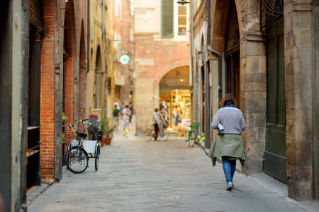 Beautiful medieval streets of Lucca city, known for its intact Renaissance-era city walls and well preserved historic center. Province of Lucca, Tuscany, Italy.の写真素材