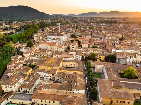 Aerial sunset view of famous Lucca city, known for its intact Renaissance-era city walls and well preserved historic center. Province of Lucca, Tuscany, Italy.の写真素材