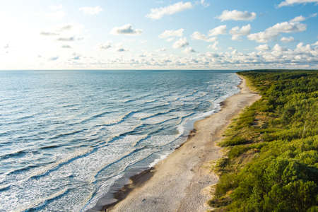 Aerial view of the Baltic Sea shore line near Klaipeda city, Lithuania. Beautiful sea coast on sunny...
