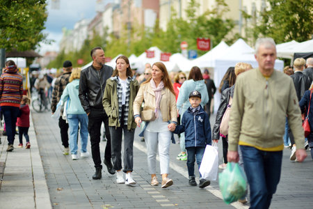 VILNIUS, LITHUANIA - SEPTEMBER 19, 2021: People attending annual Nations Fair, where masters from the national communities of Lithuania present their arts, crafts, national customs and traditions.のeditorial素材