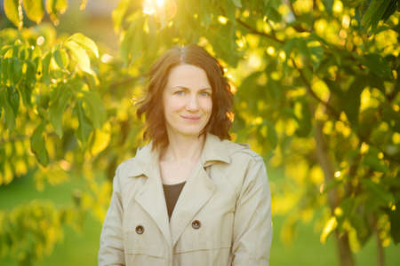 Portrait of a beautiful young woman in beautiful autumn park. Autumn season in nature.