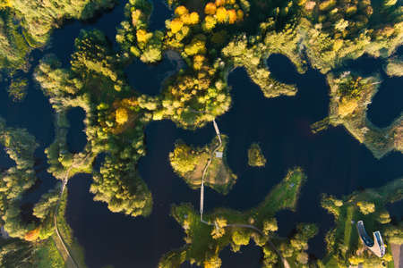 Amazing aerial view of Kirkilai karst lakes and lookout tower in the bright sunny autumn morning,...