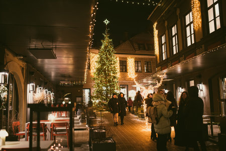 VILNIUS, LITHUANIA - DECEMBER 2021: Narrow streets of Vilnius Old Town decorated for Christmas. Celebrating Christmas and New Year in Lithuanian capital.のeditorial素材