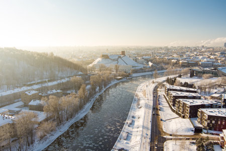 Beautiful Vilnius city panorama in winter with snow covered houses, churches and streets. Aerial evening view. Winter city scenery in Vilnius, Lithuania.の写真素材