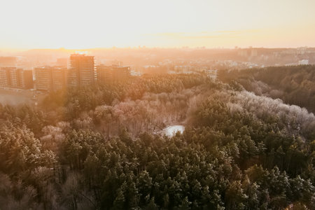 Scenic Vilnius city panorama in winter, Zirmunai district of a town. Aerial sunset view. Winter city scenery in Vilnius, Lithuania.のeditorial素材