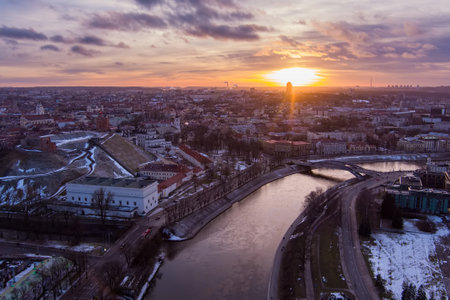 Beautiful Vilnius city panorama in winter with snow covered houses, churches and streets. Aerial sunset view. Winter city scenery in Vilnius, Lithuania.のeditorial素材