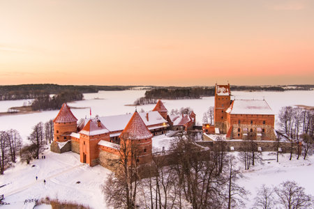 Beautiful aerial view of Trakai Island Castle, located in Trakai, Lithuania. Snow covered frozen...