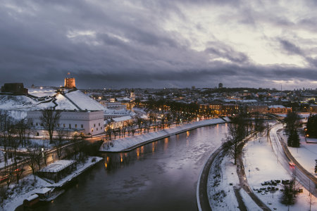 Beautiful Vilnius city panorama in winter with snow covered houses, churches and streets. Aerial sunset view. Winter city scenery in Vilnius, Lithuania.のeditorial素材