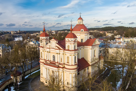 Aerial view of the Church of St. Peter and St. Paul, located in Antakalnis district in Vilnius. Beautiful winter day in the capital of Lithuania. Winter city scenery in Vilnius, Lithuania.のeditorial素材