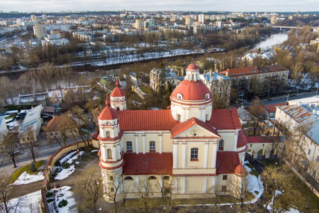 Aerial view of the Church of St. Peter and St. Paul, located in Antakalnis district in Vilnius. Beautiful winter day in the capital of Lithuania. Winter city scenery in Vilnius, Lithuania.のeditorial素材