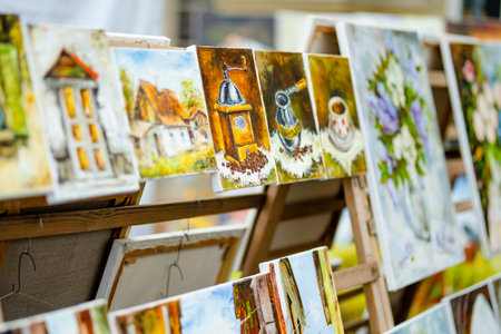 VILNIUS, LITHUANIA - MARCH 4, 2022: Painters sell their paintings on Kaziuko muge or Kaziukas,...