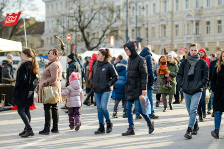 VILNIUS, LITHUANIA - MARCH 4, 2022: People attending Kaziuko muge or Kaziukas, traditional Easter market, annual crafts fair held every March on Old Town streets.のeditorial素材