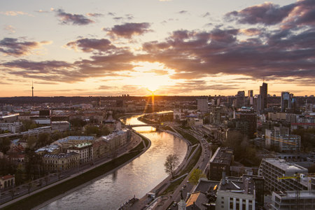 Scenic aerial view of Vilnius Old Town and Neris river at nightfall. Sunset landscape. Night view of Vilnius, Lithuania.の写真素材