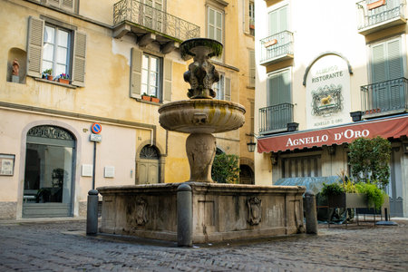 BERGAMO, ITALY - APRIL 2022: Fontana Del Gombito fountain in Bergamo city northeast of Milan. Scenic views of Citta Alta, town's upper district, encircled by Venetian walls. Bergamo, Lombardy, Italy.のeditorial素材