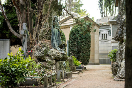 MILAN, ITALY - APRIL 2022: Impressive sculptures, tombs and monuments of Cimitero Monumentale di Milano or Monumental Cemetery of Milan. Milan, Italy.のeditorial素材