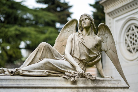Impressive sculptures on the tombs and monuments of Cimitero Monumentale di Milano or Monumental Cemetery of Milan, the burial place of the most remarkable Italians. Milan, Italy.の写真素材