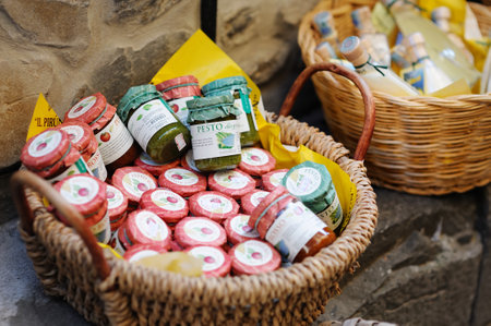 CORNIGLIA, ITALY - MAY 2011: Various food, goods and small typical souvenirs sold at small shops at the pedestrian area of Corniglia village, Cinque Terre, Liguria.のeditorial素材