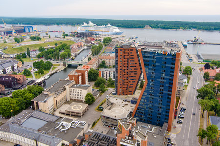 KLAIPEDA, LITHUANIA - JUNE 2022: Scenic aerial view of the Old town of Klaipeda, Lithuania in golden evening light. Klaipeda city port area and it's surroundings.のeditorial素材
