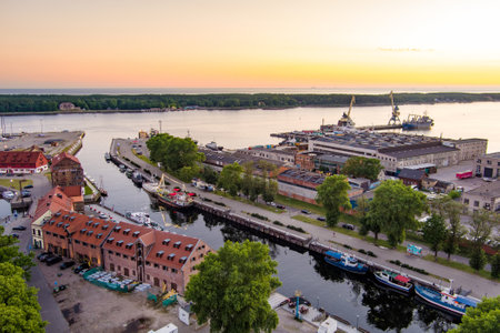 KLAIPEDA, LITHUANIA - JUNE 2022: Scenic aerial view of the Old town of Klaipeda, Lithuania, in golden evening light. Klaipeda city port area and it's surroundings on summer night.のeditorial素材