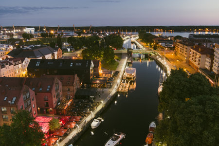 KLAIPEDA, LITHUANIA - JUNE 2022: Scenic aerial view of the Old town of Klaipeda, Lithuania, at nighttime. Klaipeda city port area and it's surroundings on summer night.のeditorial素材