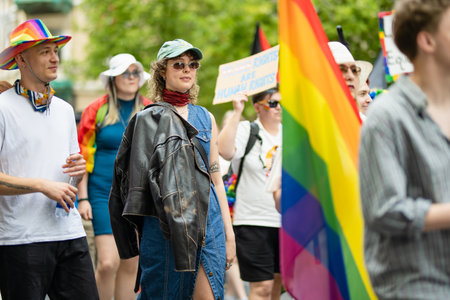 VILNIUS, LITHUANIA - JULY 1, 2023: Happy cheerful people participating in Vilnius Pride 2023 parade, that took place in Vilnius Old Town. Event celebrating lesbian, gay, bisexual, LGBTI culture pride.のeditorial素材
