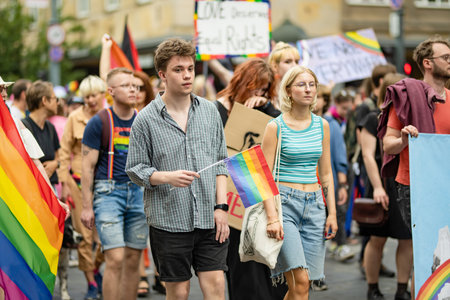 VILNIUS, LITHUANIA - JULY 1, 2023: Happy cheerful people participating in Vilnius Pride 2023 parade, that took place in Vilnius Old Town. Event celebrating lesbian, gay, bisexual, LGBTI culture pride.のeditorial素材