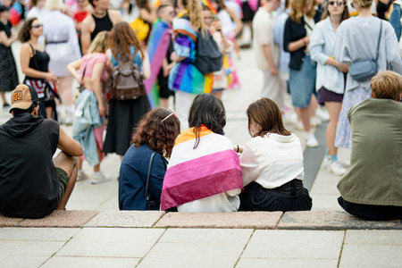VILNIUS, LITHUANIA - JULY 1, 2023: Happy cheerful people participating in Vilnius Pride 2023 parade, that took place in Vilnius Old Town. Event celebrating lesbian, gay, bisexual, LGBTI culture pride.のeditorial素材