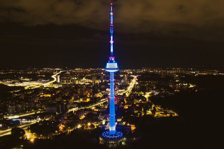 VILNIUS, LITHUANIA - SEPTEMBER 4, 2022: Scenic aerial night view of illuminated Vilnius TV tower. Nightlife of Vilnius, Lithuania.のeditorial素材