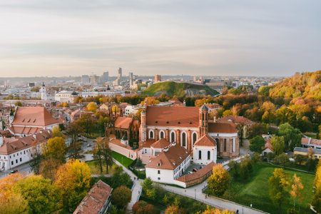 Aerial view of St. Anne Church and neighbouring Bernardine Church, one of the most beautiful and probably the most famous buildings in Vilnius. Beautiful autumn day in the capital of Lithuania.の写真素材