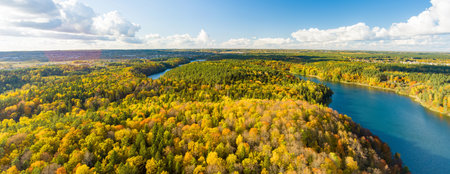 Aerial view of beautiful Balsys lake, one of six Green Lakes, located in Verkiai Regional Park. Birds eye view of scenic emerald lake surrounded by pine forests. Vilnius city, Lithuania.の写真素材
