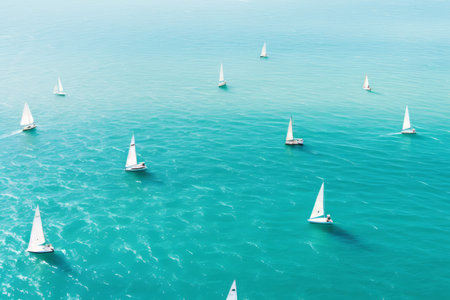 Aerial view of white yachts sailing in turquoise lagoon. Travelling and holiday concept. Generative AI.の素材