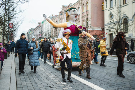 VILNIUS, LITHUANIA - FEBRUARY 21, 2023: Hundreds of people celebrating Uzgavenes, a Lithuanian annual folk festival taking place before Easter. Participants wearing traditional masks and costumes.のeditorial素材