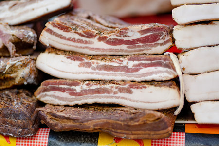 Selection of assorted home made meats, jerky and sausages on a farmers market in Vilnius, Lithuania....